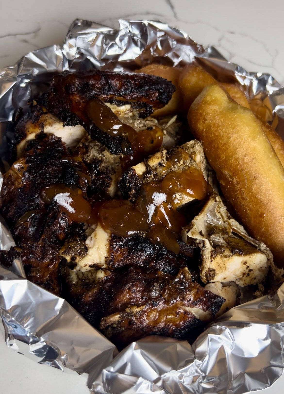 Jamaican Jerk Chicken and Festival served "street food" style.