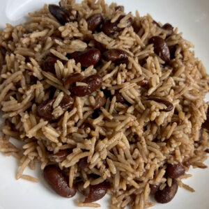 A bowl of Jamaican rice and peas with evenly cooked rice and beans, highlighting the texture and color.