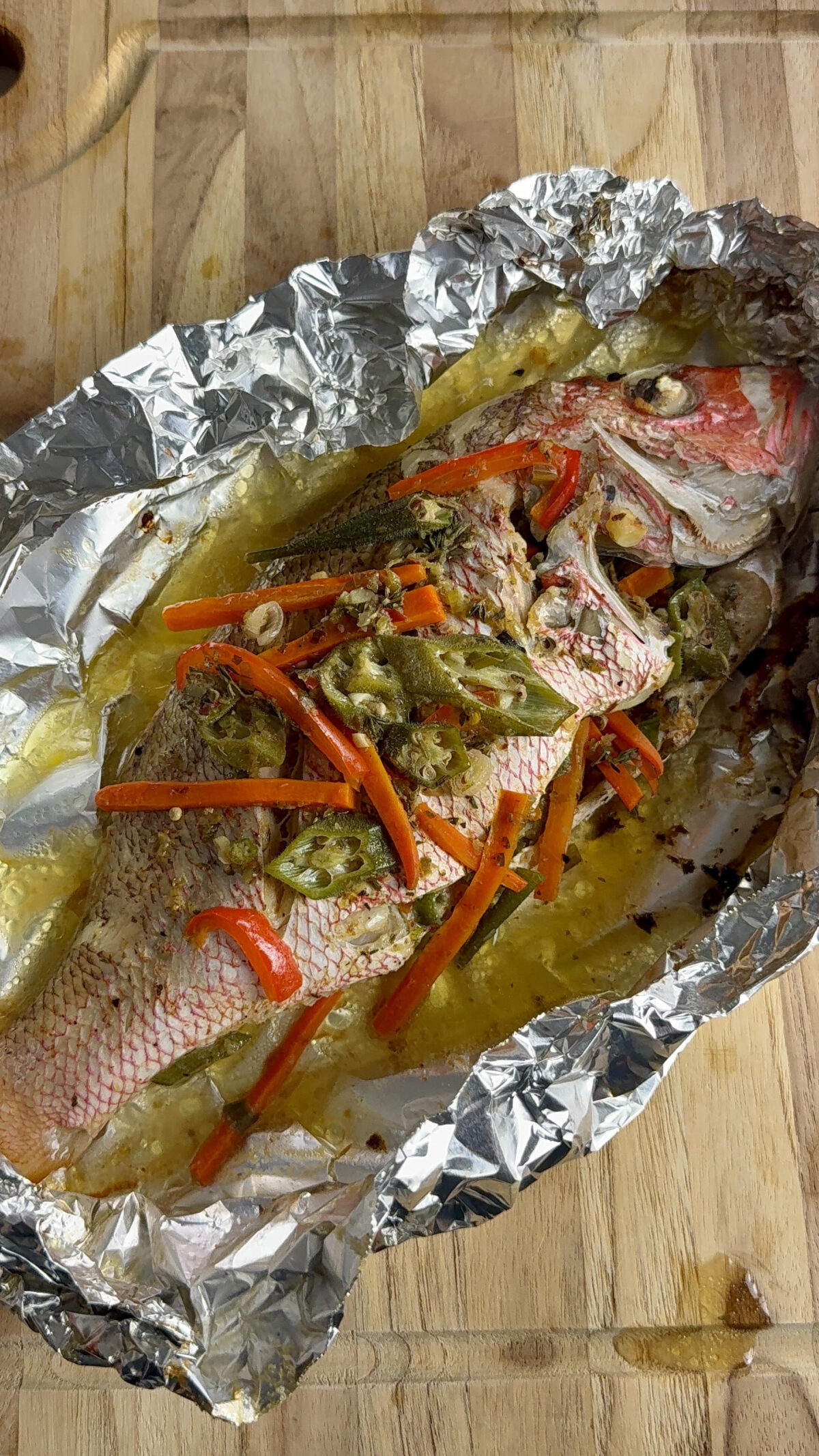 Jamaican Roast Fish with buttery seasoned vegetables fresh off the grill