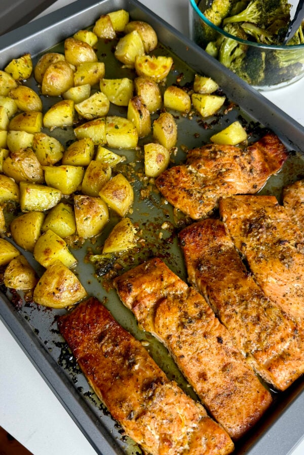 Honey garlic salmon, crispy roasted garlic potatoes, and tender broccoli come together on one sheet pan.