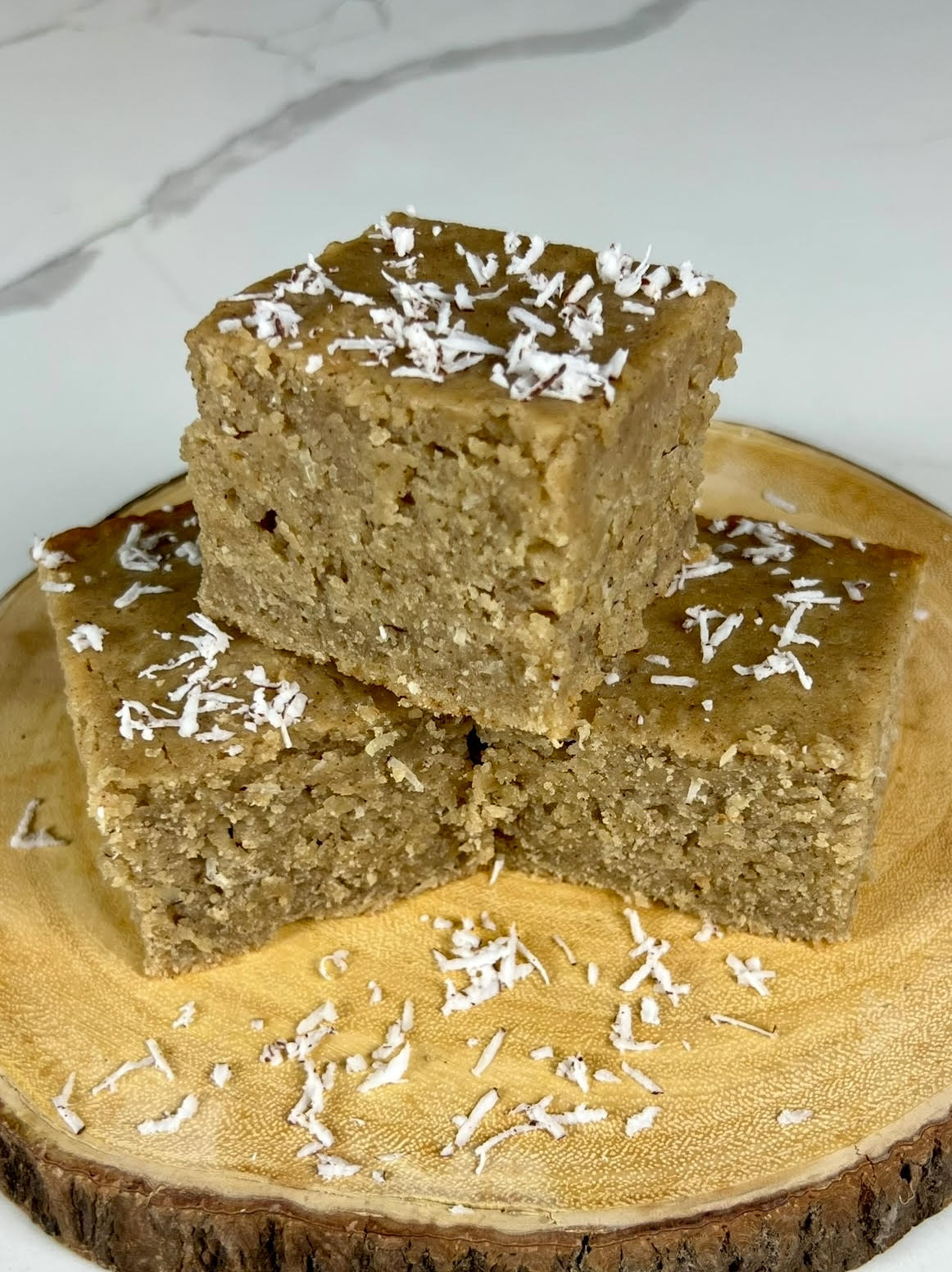 Jamaican Toto (Coconut Cake) sprinkled with coconut flakes